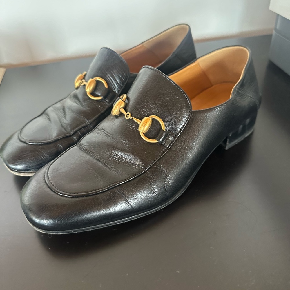 Women’s black Gucci horse bit loafer